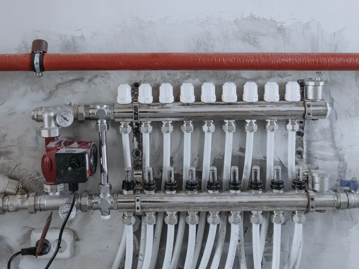 A plumbing manifold with pressure gauges, isolation valves and branch lines